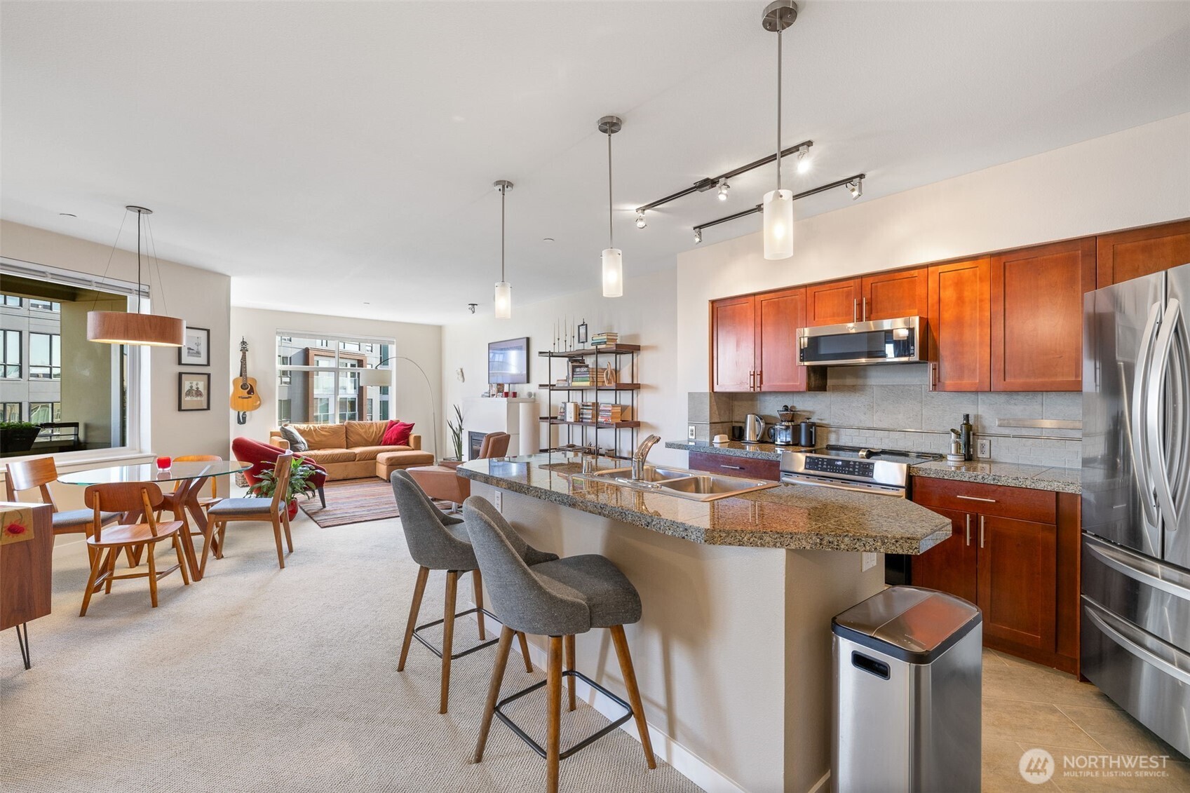 5440 Leary Avenue Northwest, Unit 617 Seattle, WA 98107 - Photo 5 of 28 a kitchen with kitchen island a large counter top space appliances and cabinets