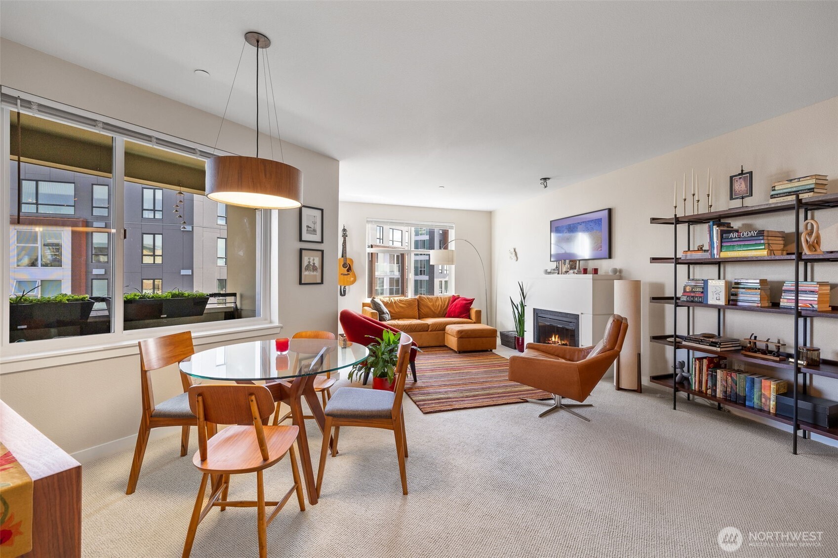 5440 Leary Avenue Northwest, Unit 617 Seattle, WA 98107 - Photo 7 of 28 a living room with lots of furniture and a flat screen tv