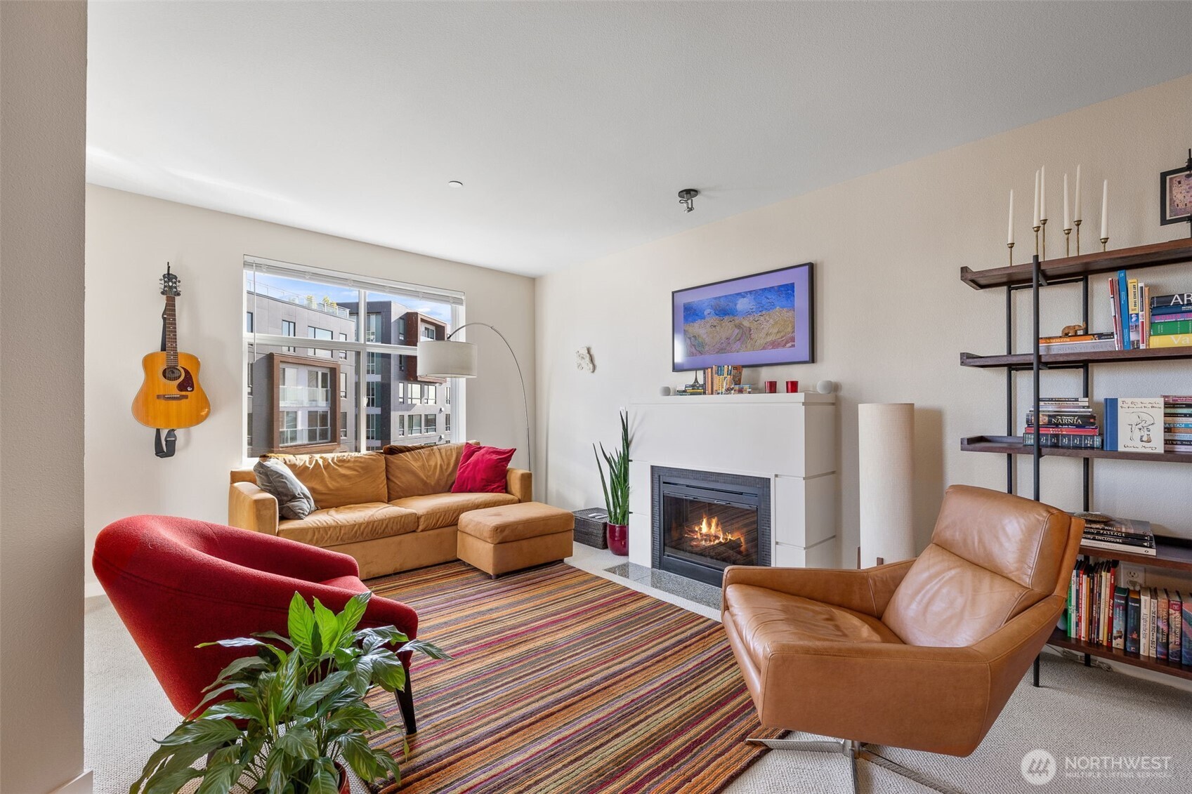5440 Leary Avenue Northwest, Unit 617 Seattle, WA 98107 - Photo 9 of 28 a living room with furniture and a fireplace
