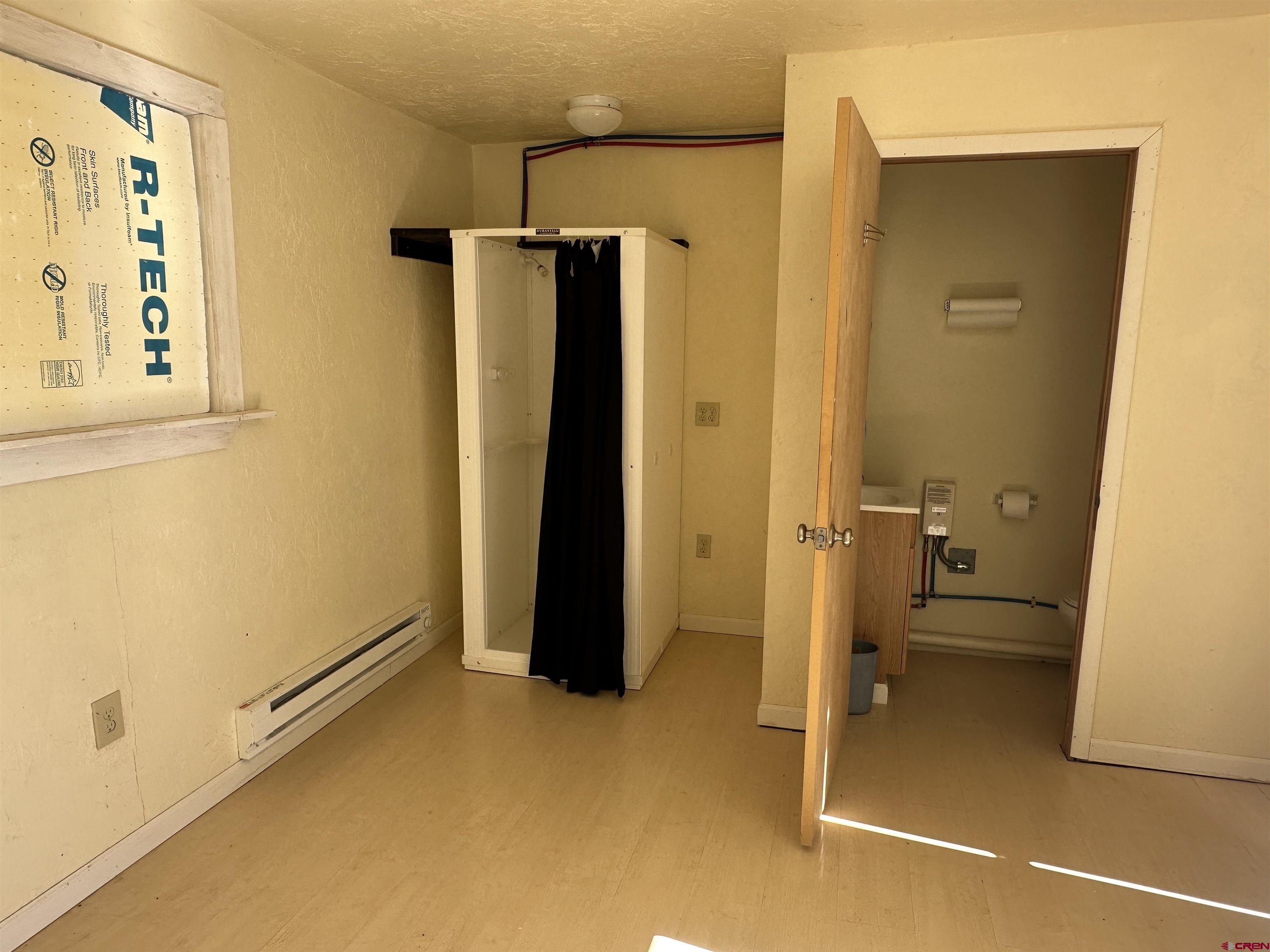 63345 Ida Road Montrose, CO 81401 - Photo 14 of 22 a bathroom with a tub and a shower