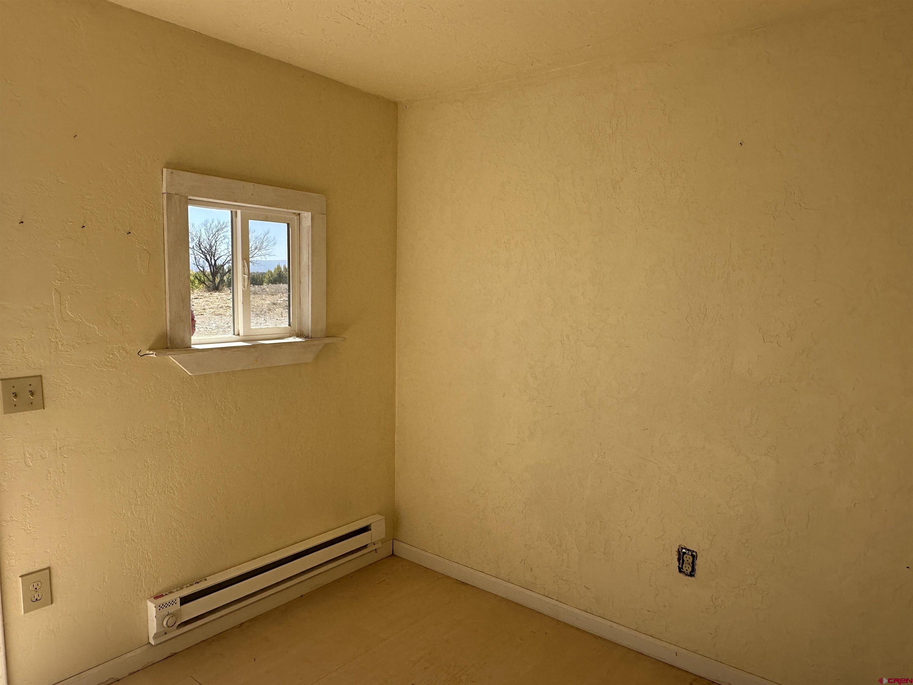 63345 Ida Road Montrose, CO 81401 - Photo 15 of 22 an empty room with a window