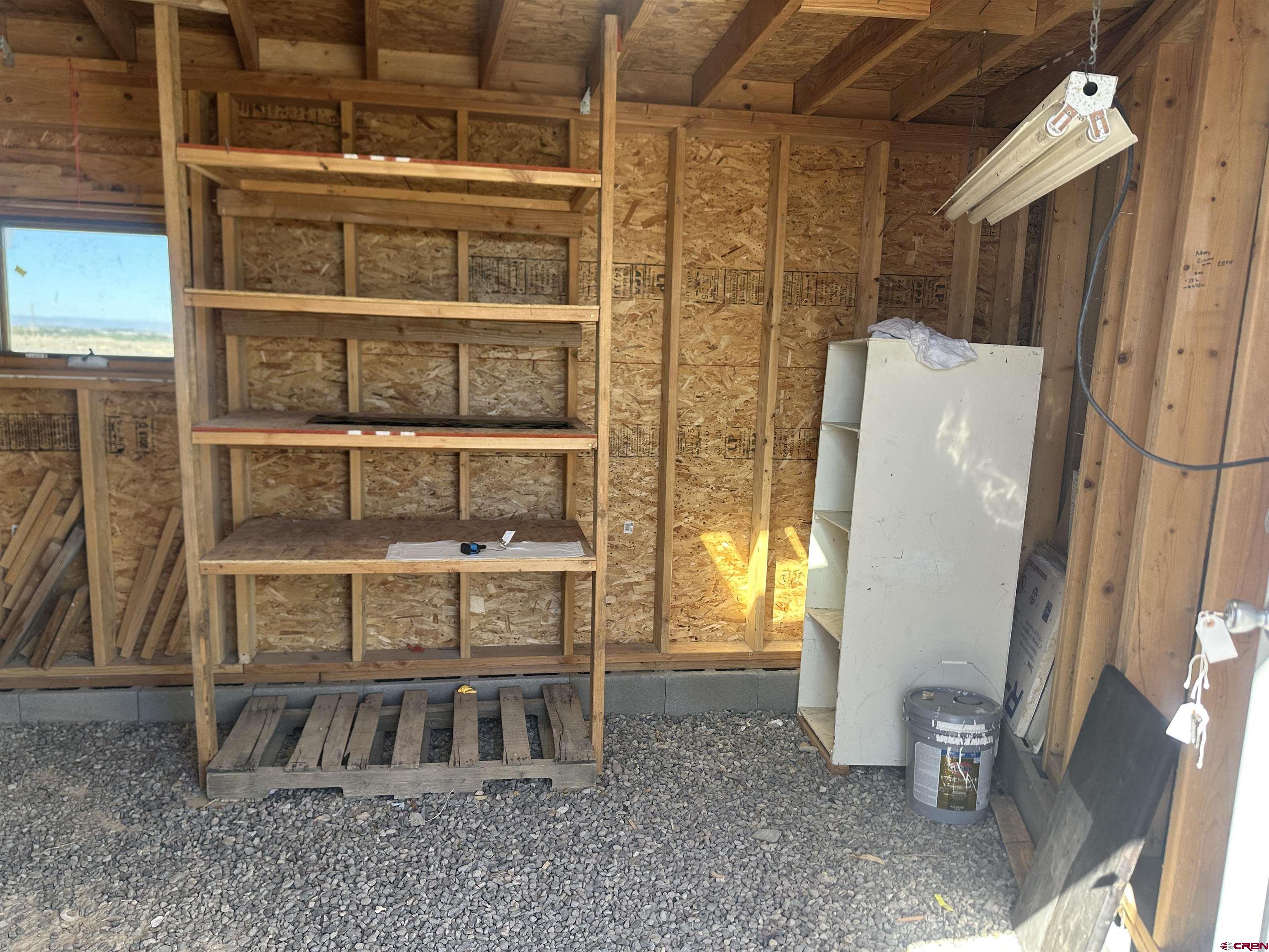 63345 Ida Road Montrose, CO 81401 - Photo 16 of 22 a view of walk in closet with empty racks