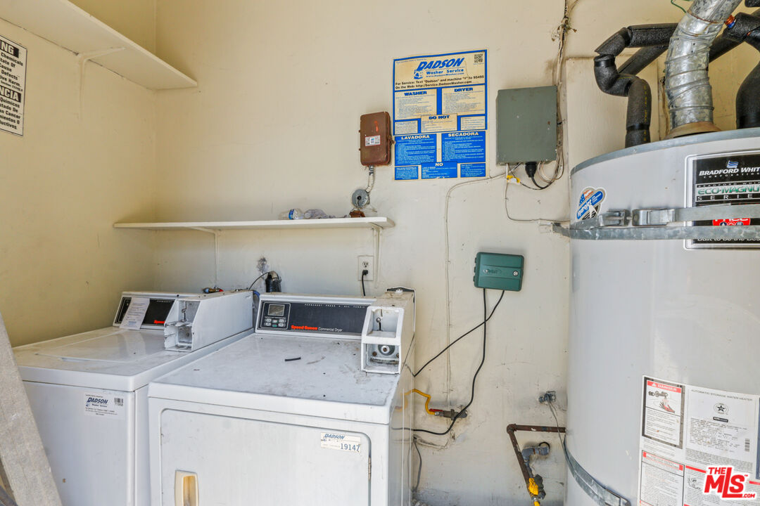 10024 Foster Road Bellflower, CA 90706 - Photo 11 of 29 a view of storage and utility room with racks on the wall