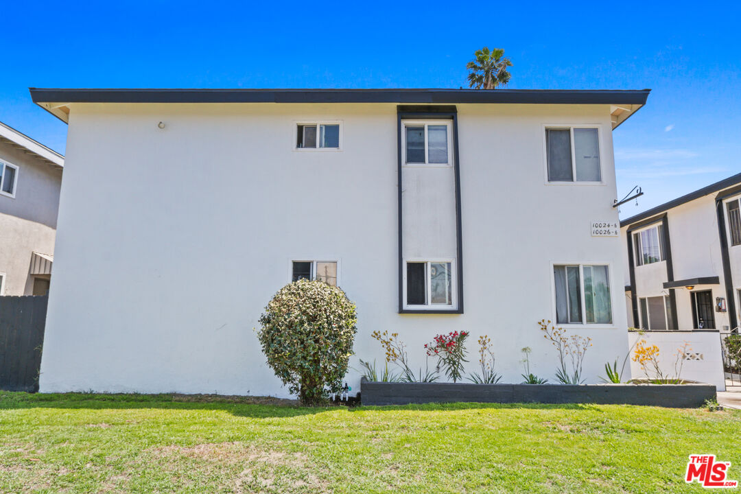 10024 Foster Road Bellflower, CA 90706 - Photo 2 of 29 a front view of a house with a yard