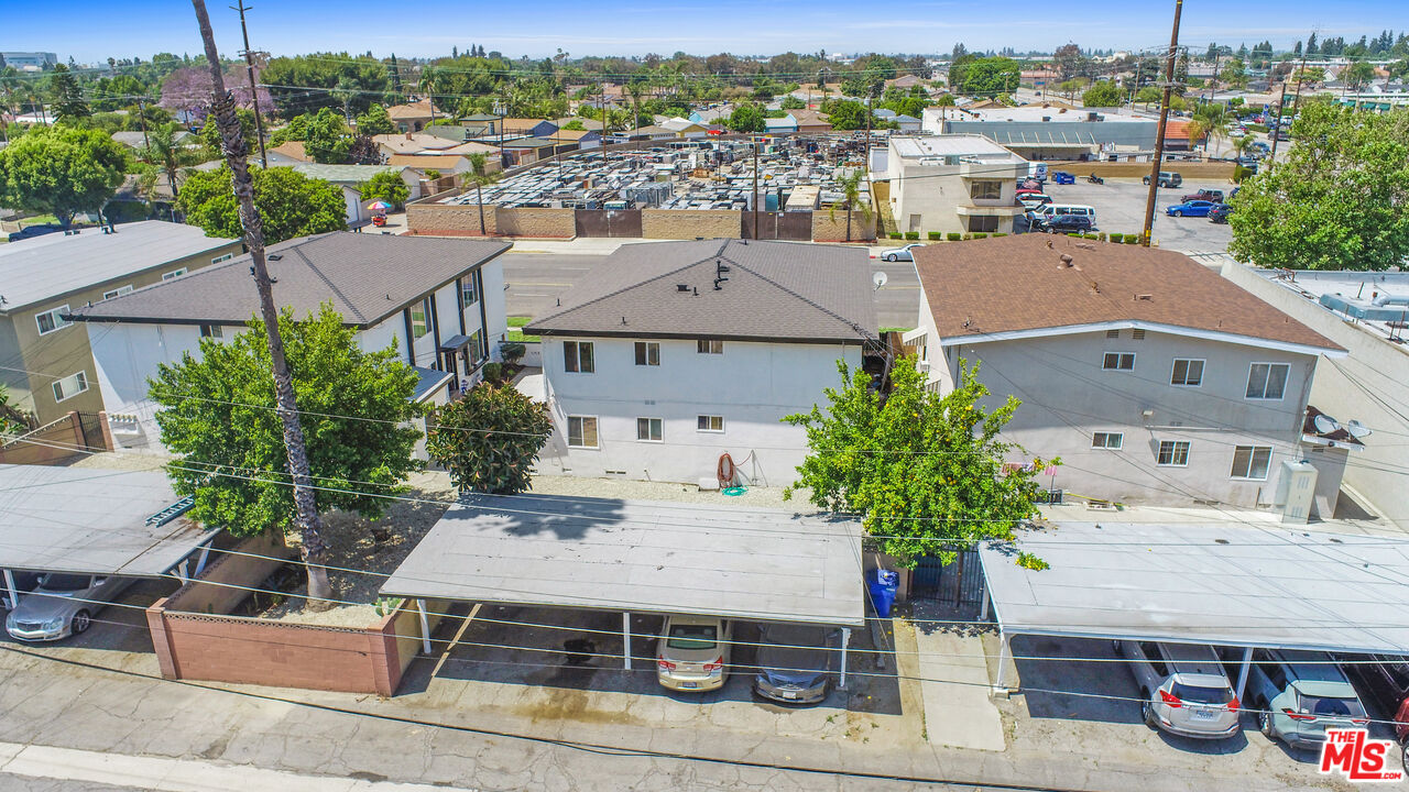 10024 Foster Road Bellflower, CA 90706 - Photo 25 of 29 an aerial view of a house with a yard large trees and plants