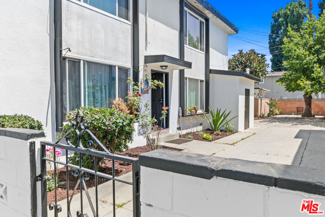 10024 Foster Road Bellflower, CA 90706 - Photo 3 of 29 a view of an house with backyard and sitting area