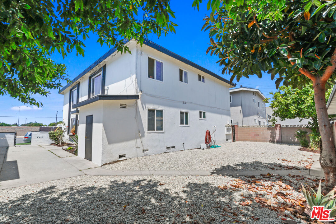 10024 Foster Road Bellflower, CA 90706 - Photo 6 of 29 a view of a house with a yard