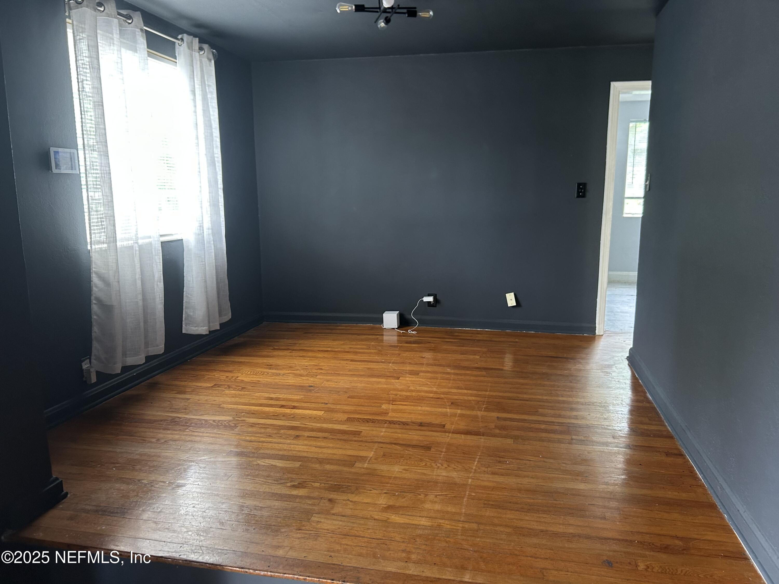 3173 St Augustine Road Jacksonville, FL 32207 - Photo 16 of 19 a view of a room with wooden floor