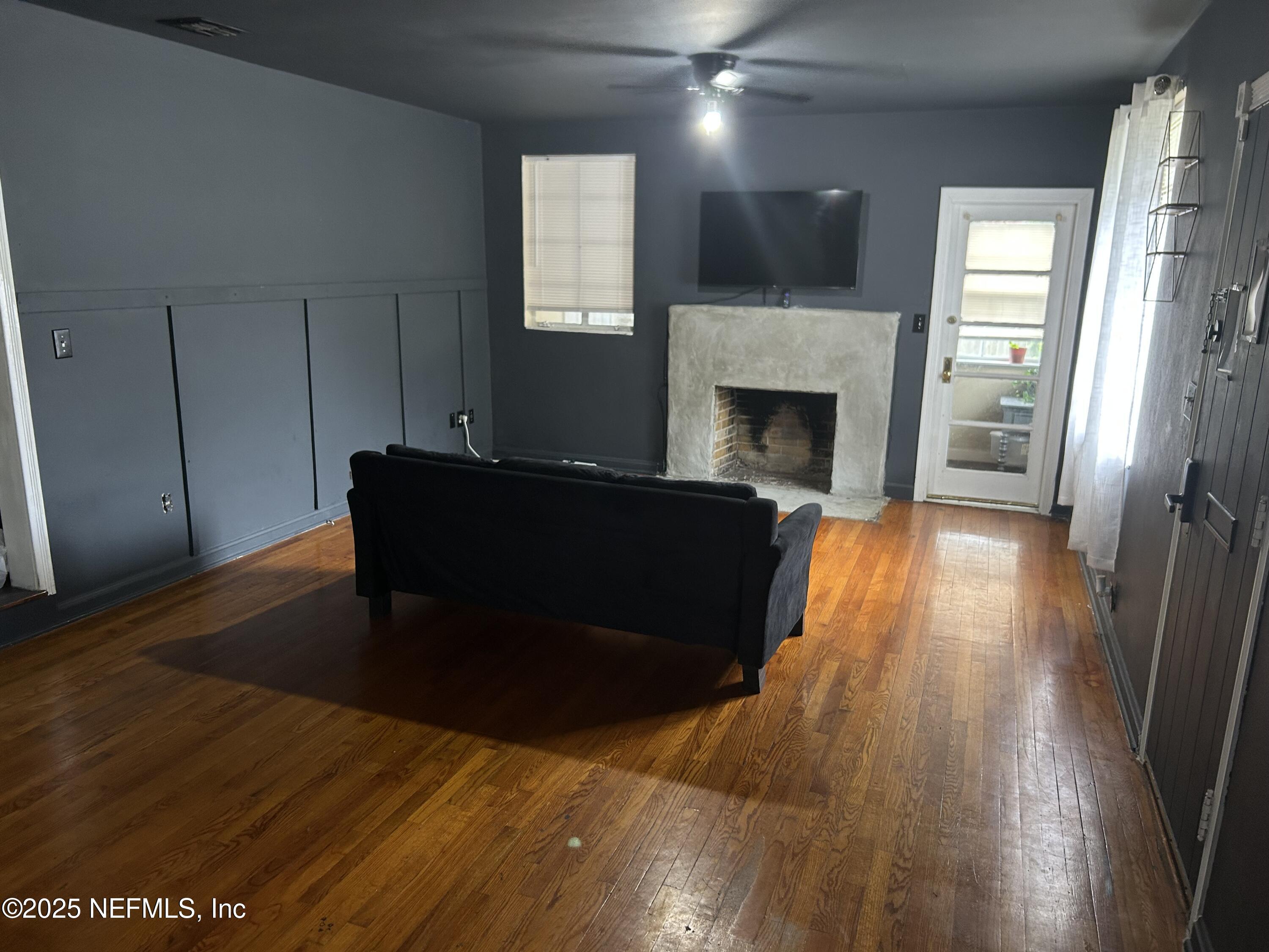 3173 St Augustine Road Jacksonville, FL 32207 - Photo 17 of 19 a living room with a fireplace furniture and a fireplace