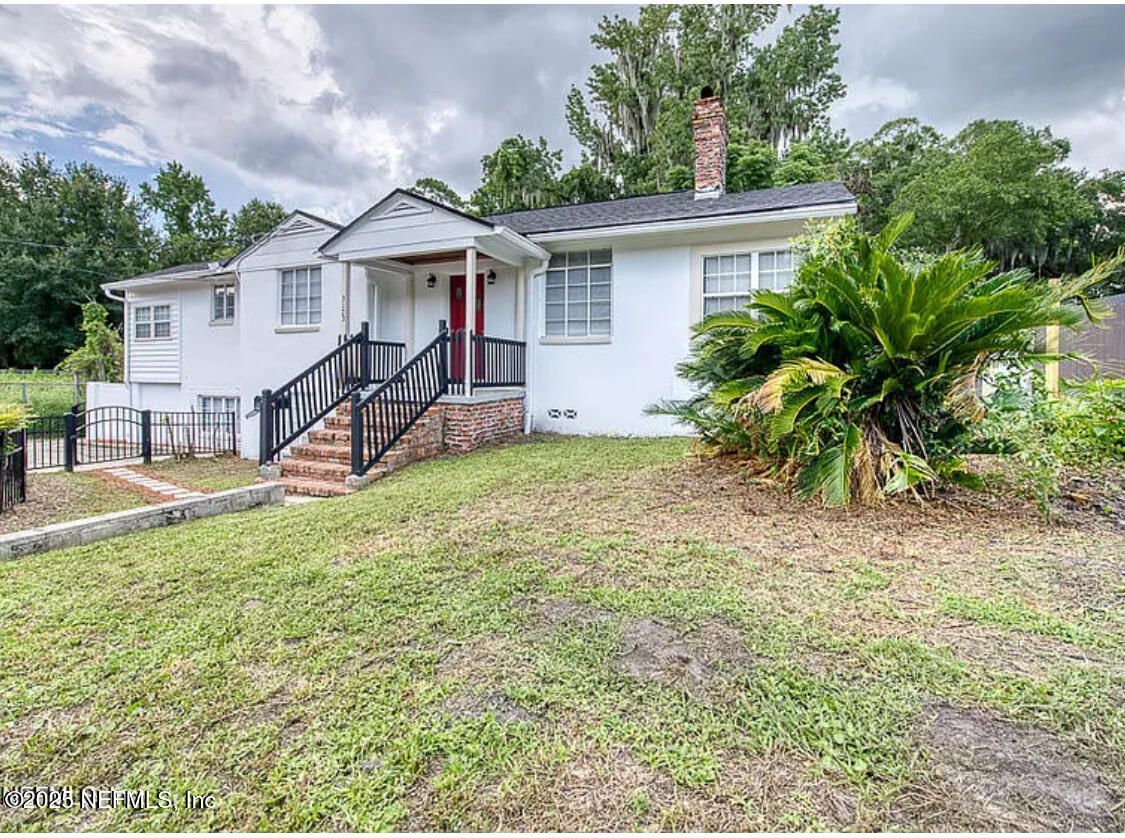 3173 St Augustine Road Jacksonville, FL 32207 - Photo 2 of 19 a view of a house with a yard and sitting area