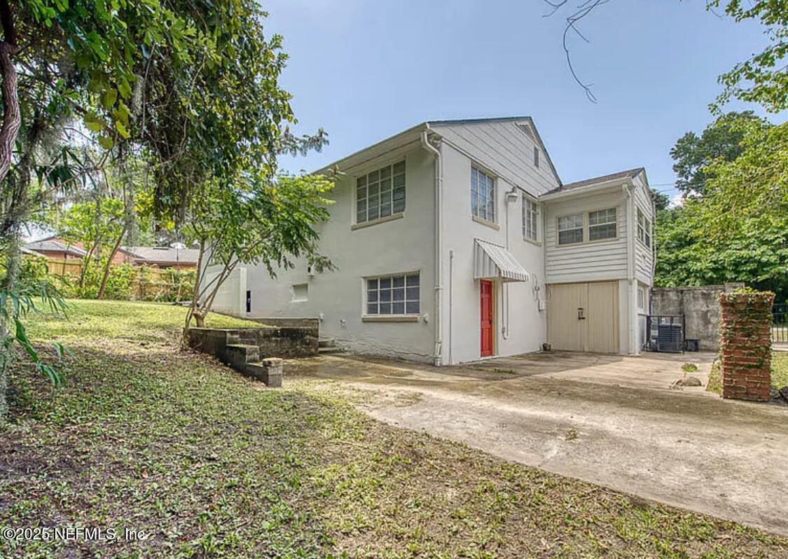 3173 St Augustine Road Jacksonville, FL 32207 - Photo 5 of 19 a view of a house with a yard