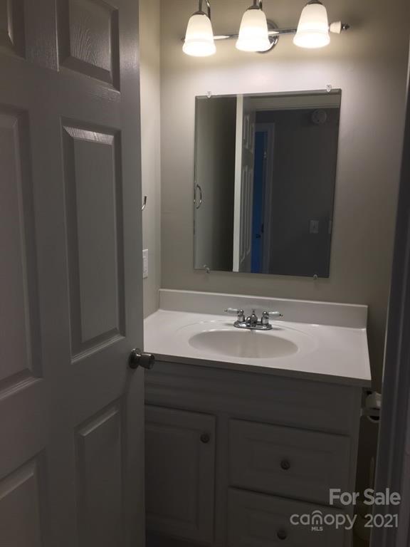 58 Ross Farm Road Waynesville, NC 28786 - Photo 24 of 29 a bathroom with a sink and a mirror