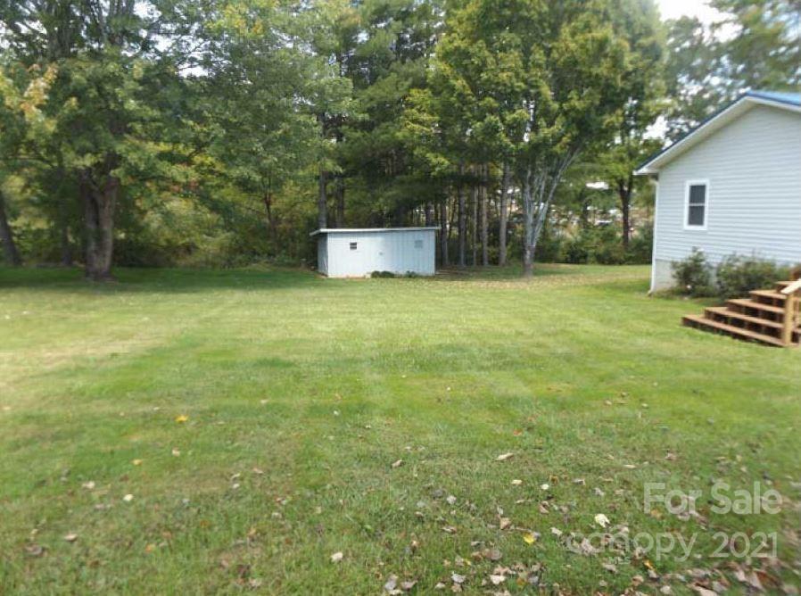 58 Ross Farm Road Waynesville, NC 28786 - Photo 9 of 29 a backyard of a house with lots of green space