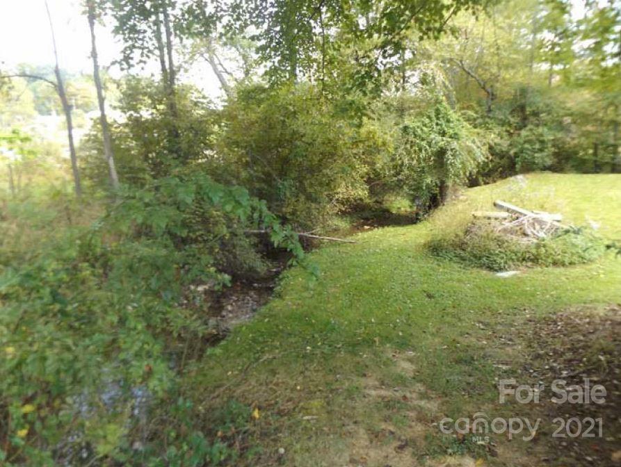 58 Ross Farm Road Waynesville, NC 28786 - Photo 10 of 29 a view of a yard with large trees