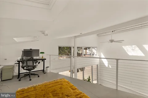 a view of a workspace with furniture