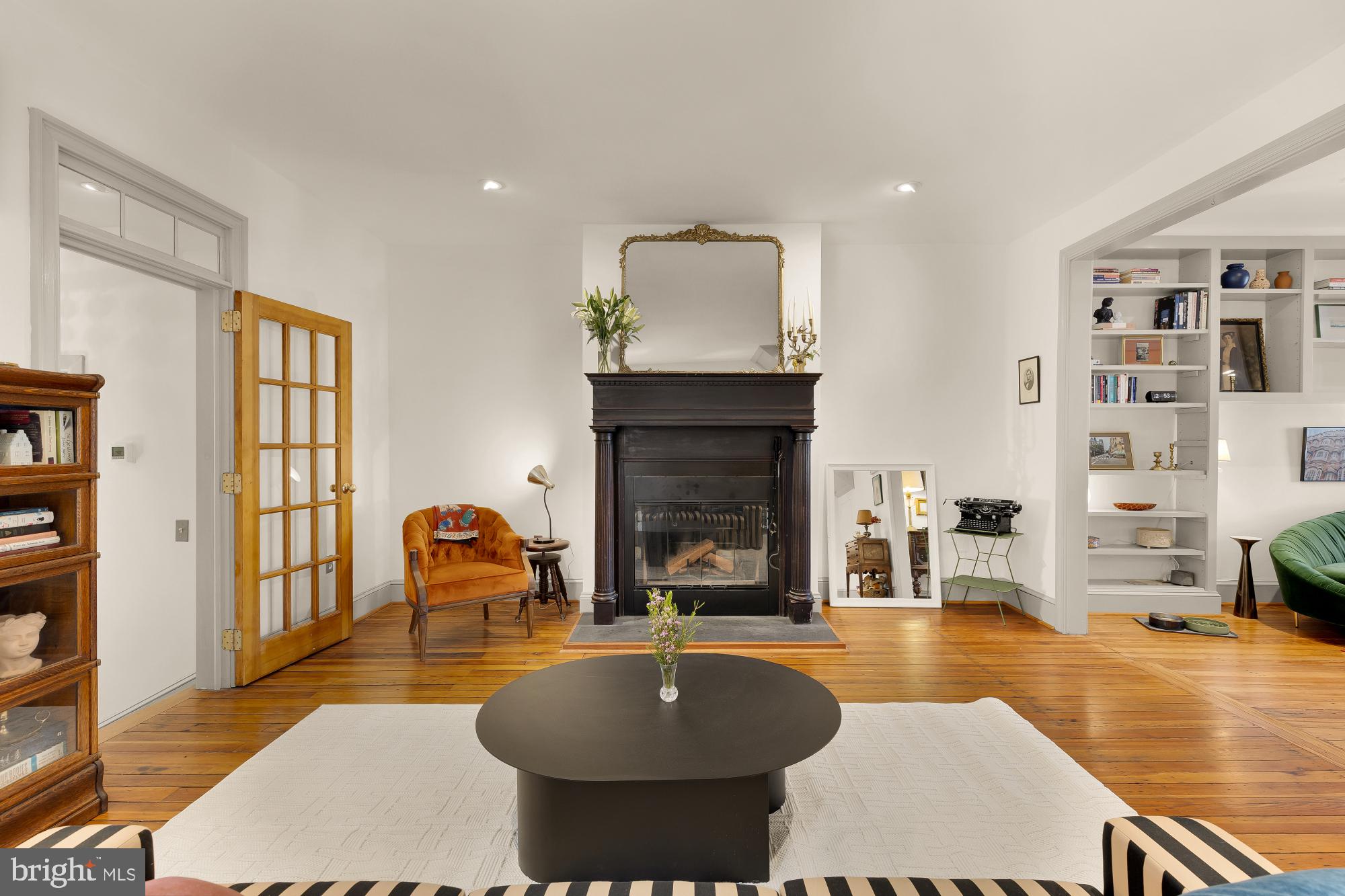 20 9th Street Northeast Washington, DC 20002 - Photo 5 of 32 a living room with fireplace furniture and a wooden floor