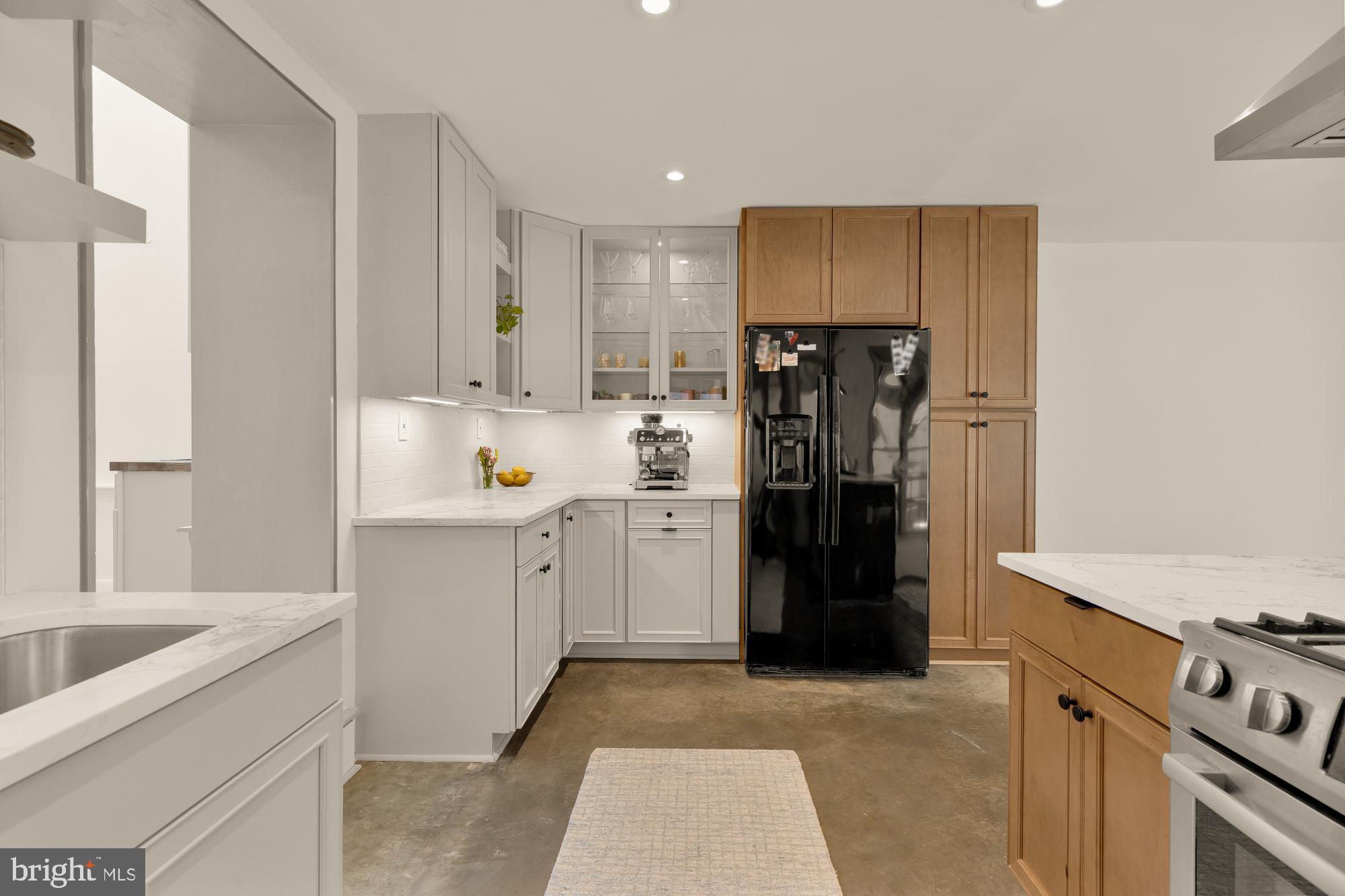 20 9th Street Northeast Washington, DC 20002 - Photo 9 of 32 a kitchen with a refrigerator and a sink