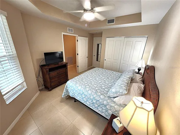 a kitchen with stainless steel appliances granite countertop white cabinets a sink and a stove