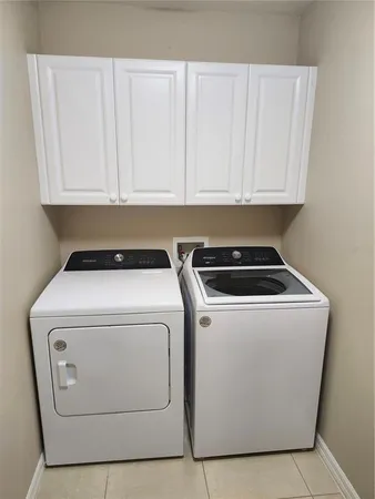 a living room with lots of furniture and a chandelier
