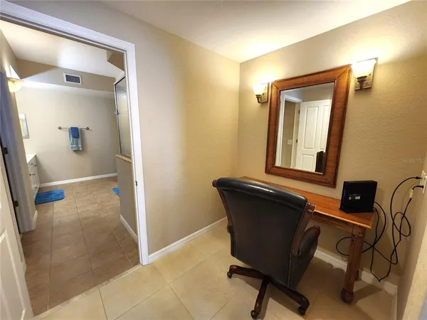 a view of a livingroom with furniture and a ceiling fan