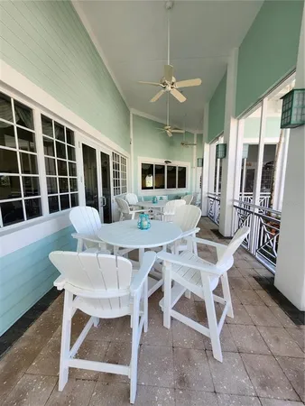 a view of a patio with table and chairs and potted plants
