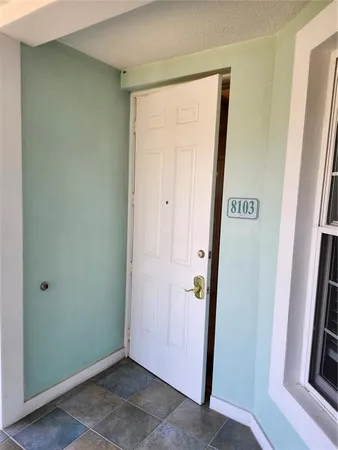 a bedroom with a large bed and a dresser