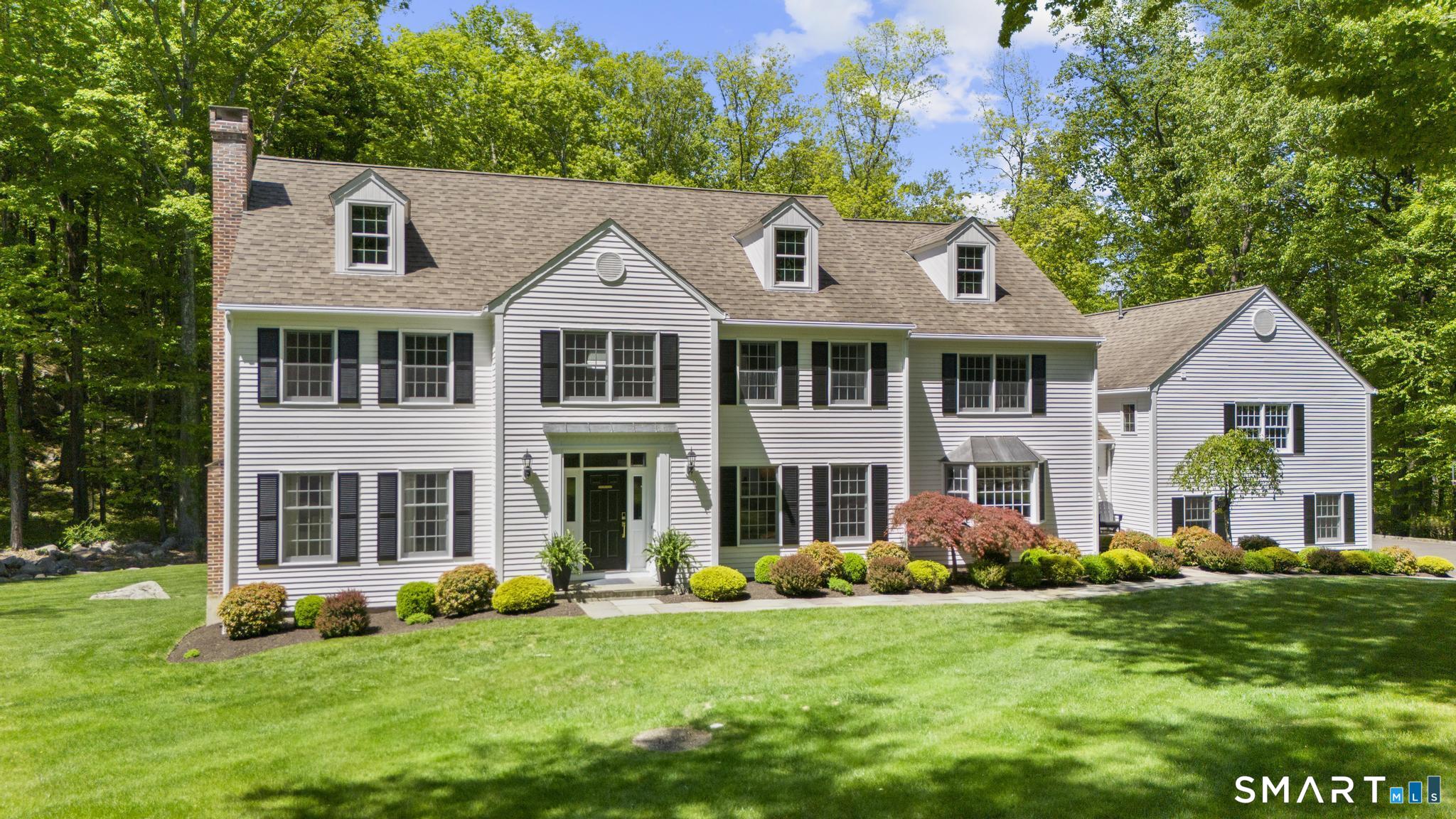 181 Old Branchville Road Ridgefield, CT 06877 - Photo 1 of 40 a front view of a house with a yard