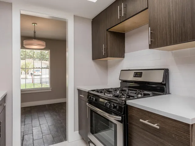 a kitchen with a stove and a microwave