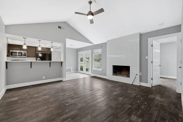 a view of a kitchen with wooden floor and a kitchen