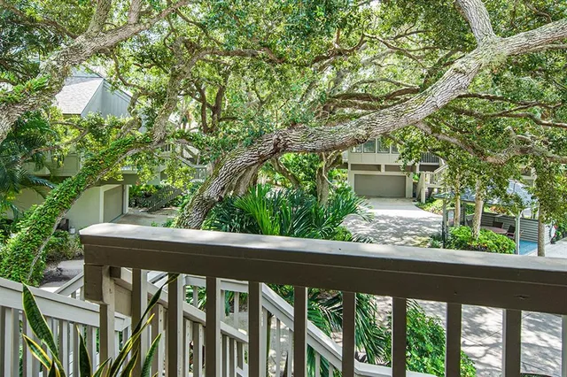 a bedroom with a bed next to a window