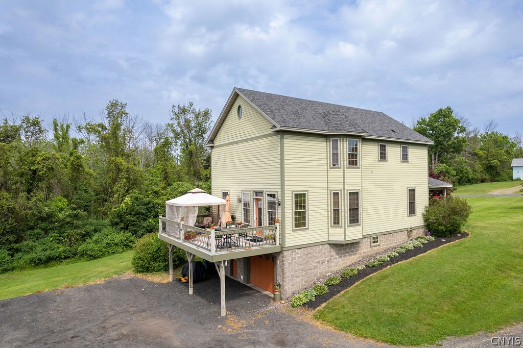 321 West Lake Road Oswego, NY 13126 - Photo 36 of 49 Drone perspective of the back of the home highligh