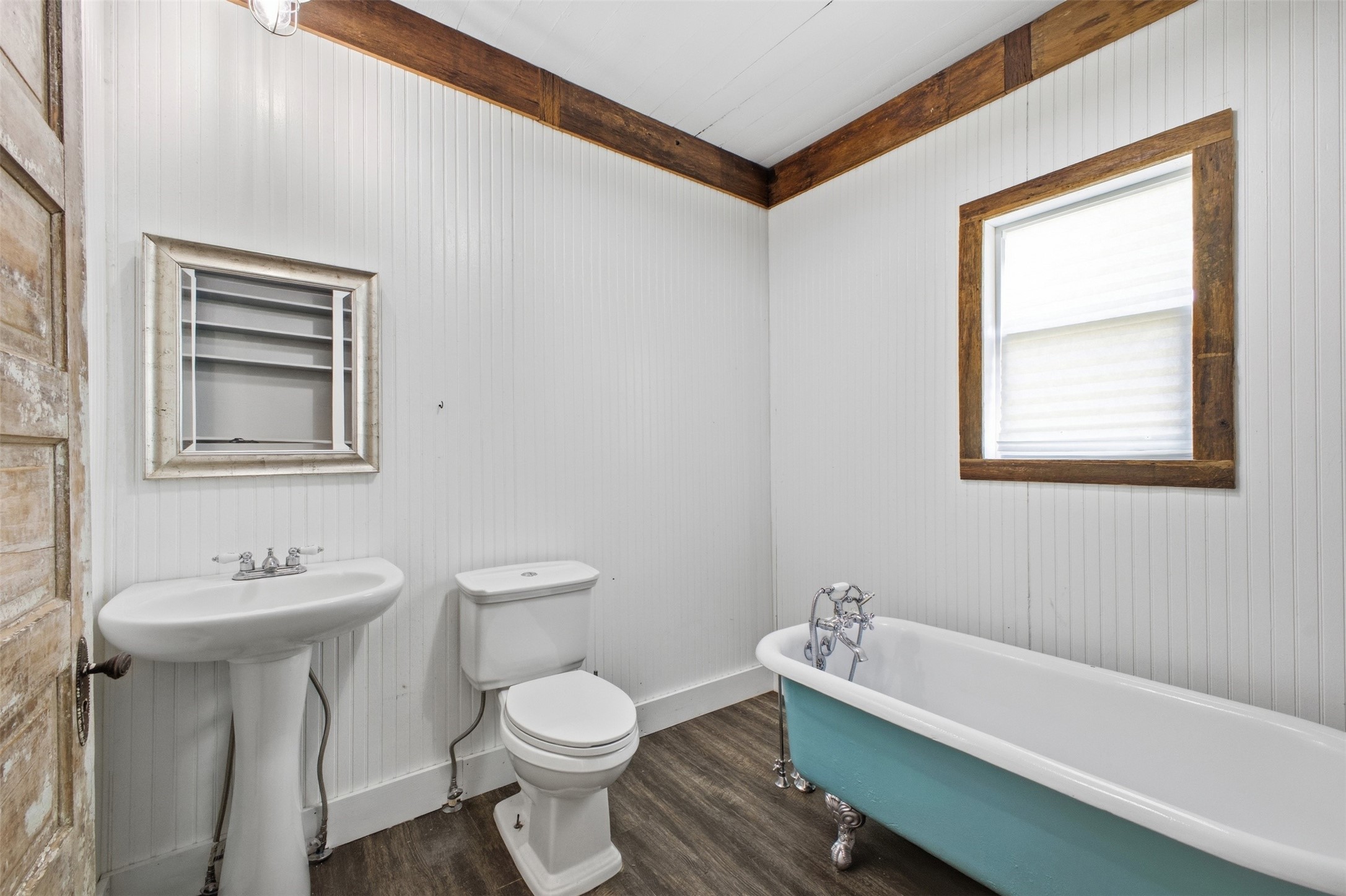 1903 Tigerpoint Road Brenham, TX 77833 - Photo 14 of 27 a bathroom with a toilet a sink and mirror
