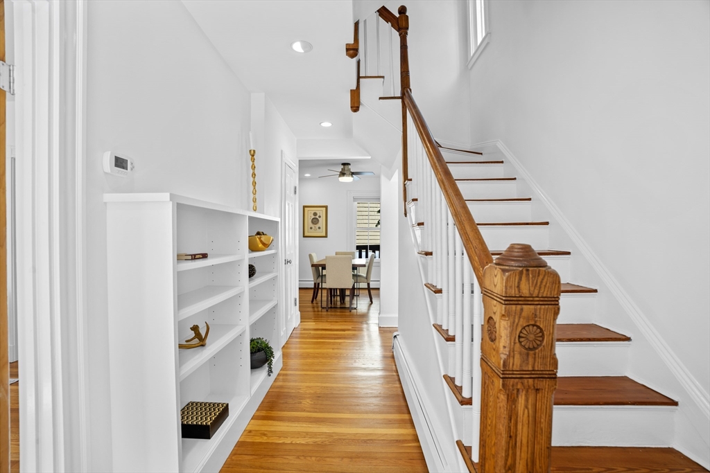 81 Franklin Street Brookline, MA 02445 - Photo 12 of 25 a view of a hallway with wooden floor and staircase