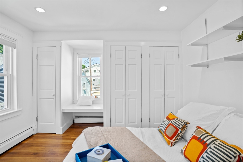 81 Franklin Street Brookline, MA 02445 - Photo 14 of 25 a bedroom with a bed and a window