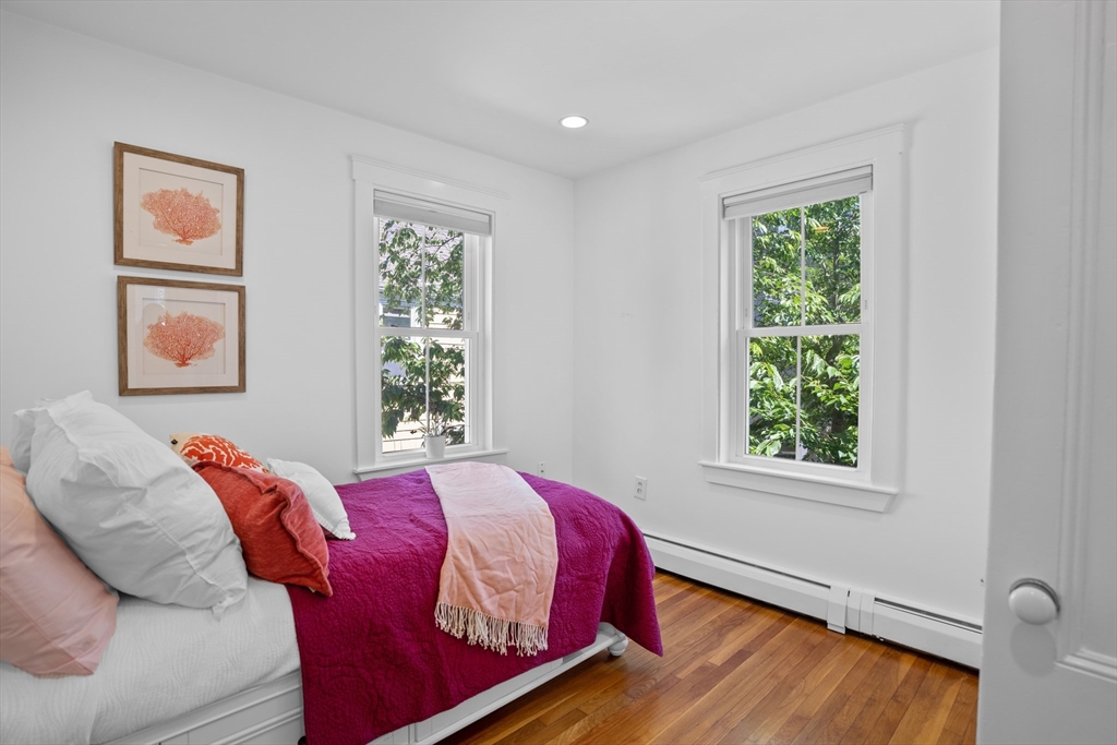 81 Franklin Street Brookline, MA 02445 - Photo 15 of 25 a bed sitting in a bedroom next to a window