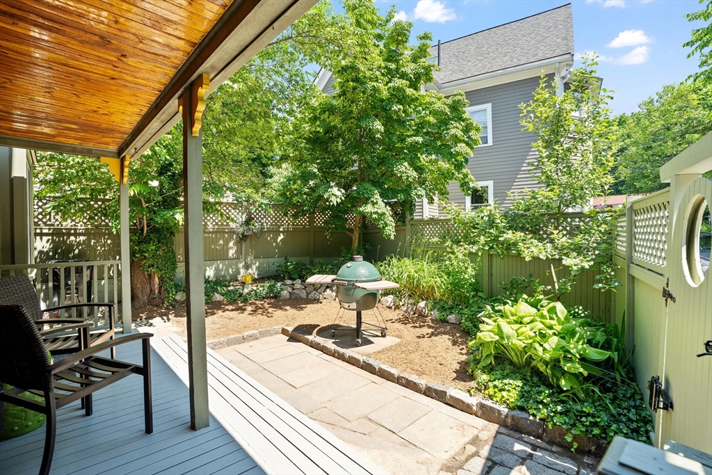 81 Franklin Street Brookline, MA 02445 - Photo 22 of 25 a view of a patio with table and chairs and potted plants