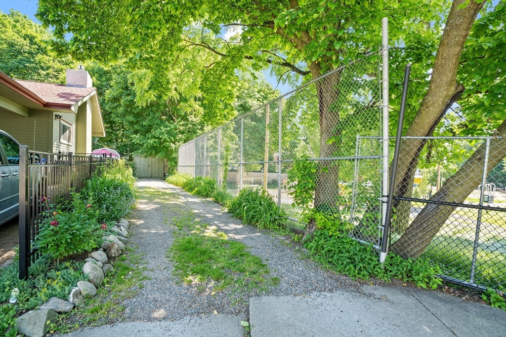 81 Franklin Street Brookline, MA 02445 - Photo 24 of 25 a view of yard with green space