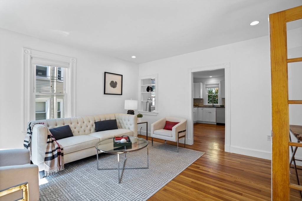 81 Franklin Street Brookline, MA 02445 - Photo 4 of 25 a living room with furniture and a wooden floor