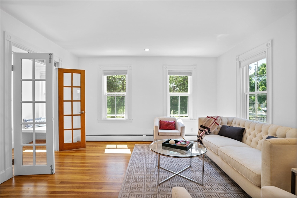81 Franklin Street Brookline, MA 02445 - Photo 5 of 25 a living room with furniture and a window with wooden floor
