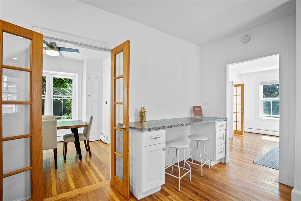 81 Franklin Street Brookline, MA 02445 - Photo 9 of 25 a view of a livingroom with furniture and a large window