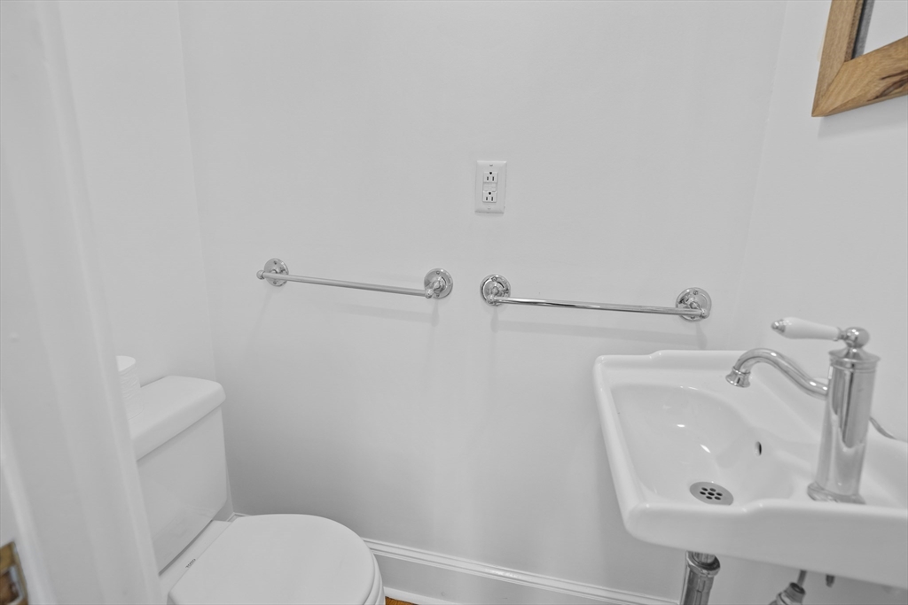 81 Franklin Street Brookline, MA 02445 - Photo 10 of 25 a bathroom with a sink and a toilet