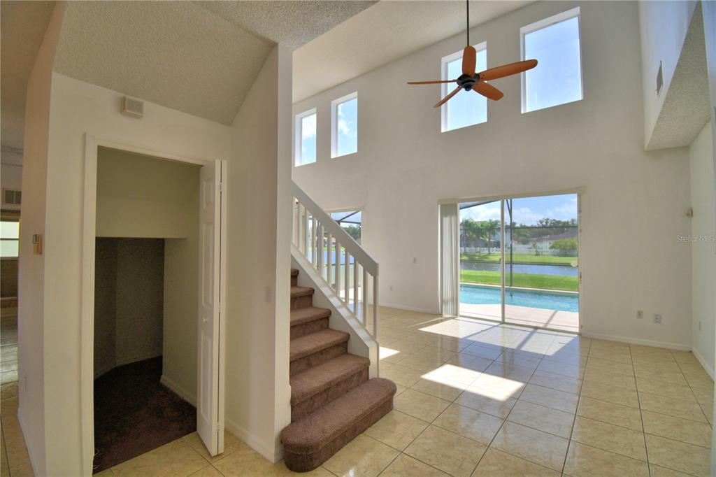 5368 Dahlia Reserve Drive Kissimmee, FL 34758 - Photo 11 of 83 a view of entryway and hall with wooden floor