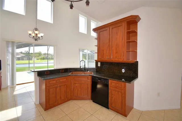 a view of room with window and ceiling fan