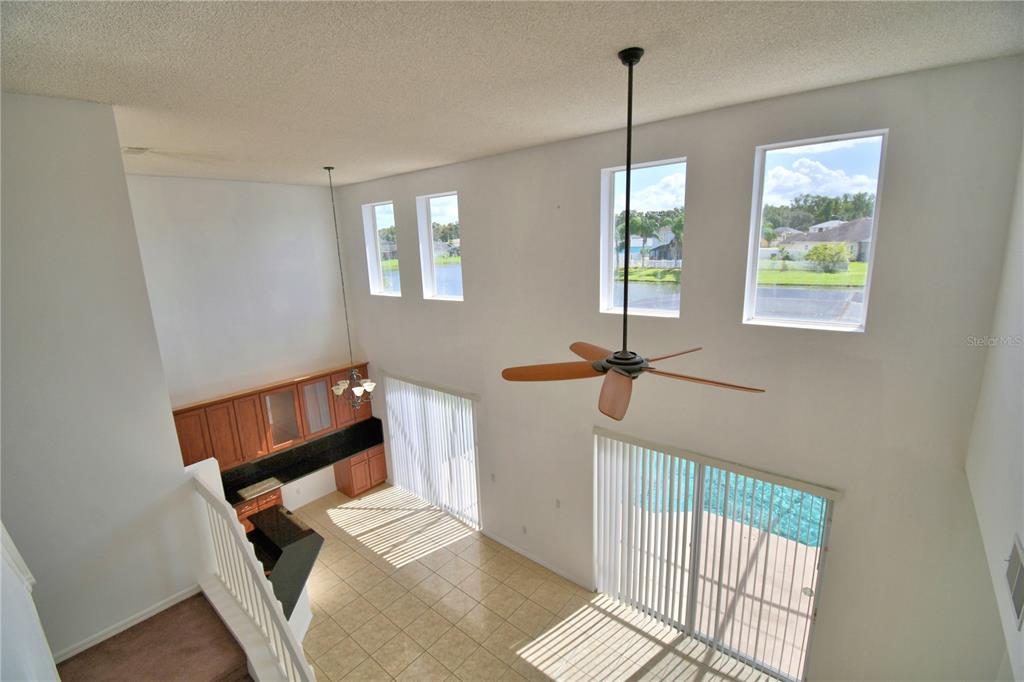 5368 Dahlia Reserve Drive Kissimmee, FL 34758 - Photo 35 of 83 a view of hallway with windows