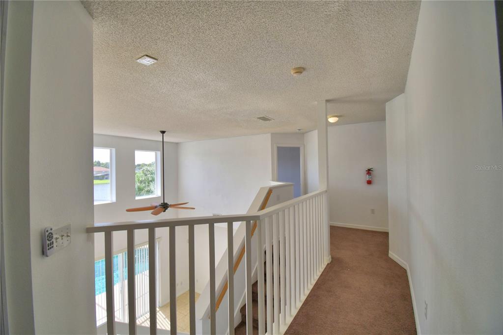 5368 Dahlia Reserve Drive Kissimmee, FL 34758 - Photo 36 of 83 a view of a hallway with windows