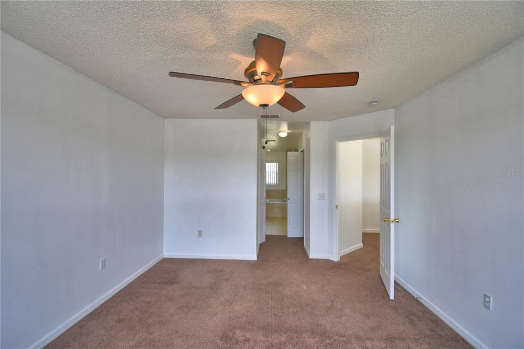 5368 Dahlia Reserve Drive Kissimmee, FL 34758 - Photo 38 of 83 a view of a chandelier fan and a chandelier fan