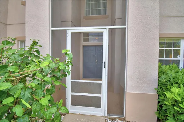 a view of an empty room with windows