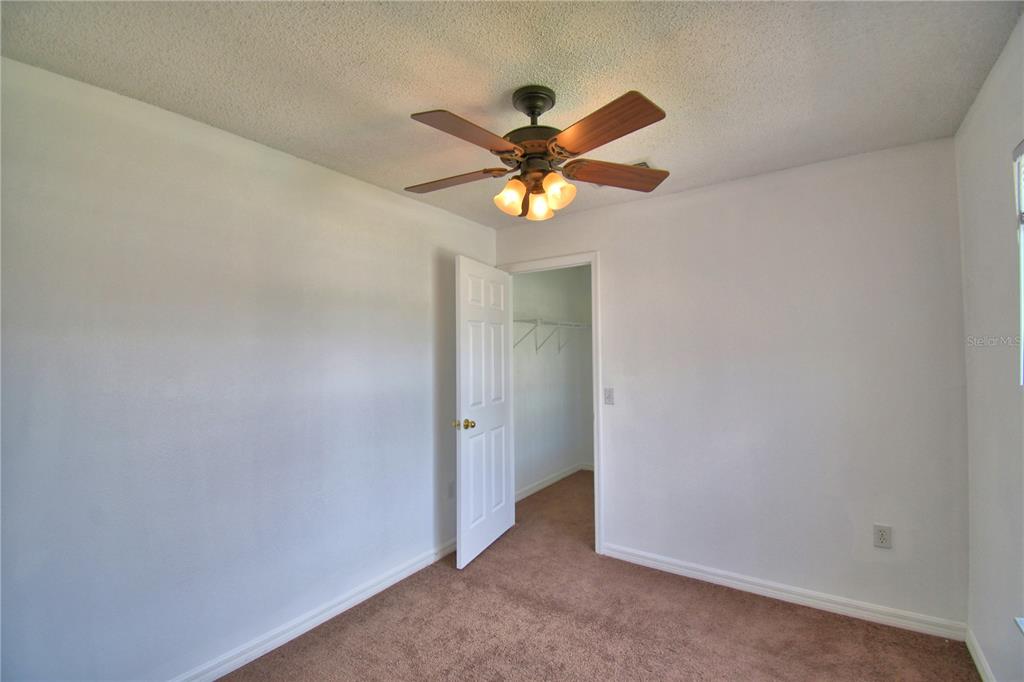 5368 Dahlia Reserve Drive Kissimmee, FL 34758 - Photo 41 of 83 a view of a chandelier fan in a room