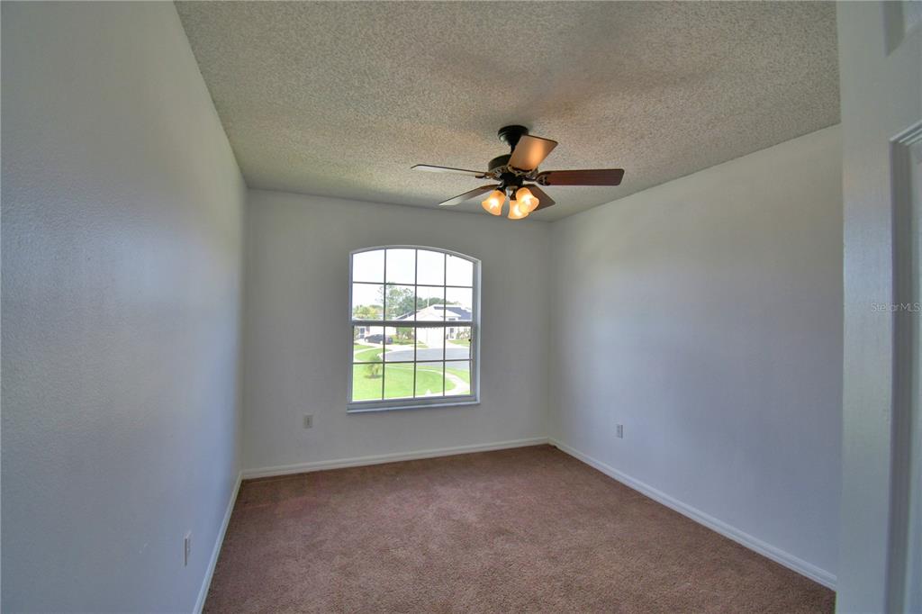 5368 Dahlia Reserve Drive Kissimmee, FL 34758 - Photo 48 of 83 an empty room with a window