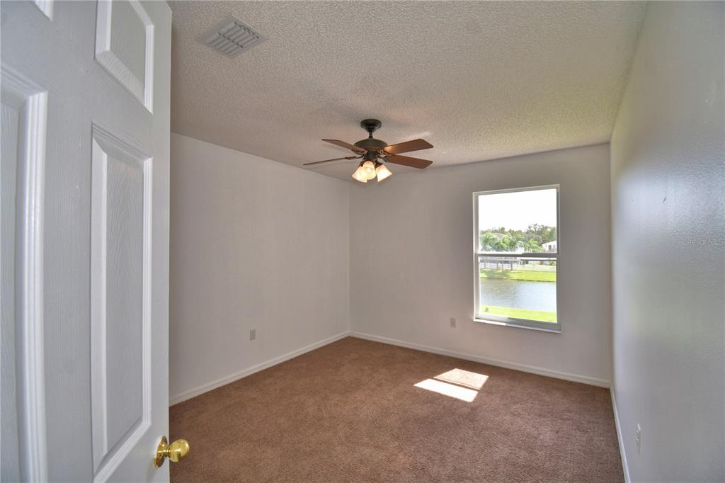 5368 Dahlia Reserve Drive Kissimmee, FL 34758 - Photo 51 of 83 a view of an empty room with a window
